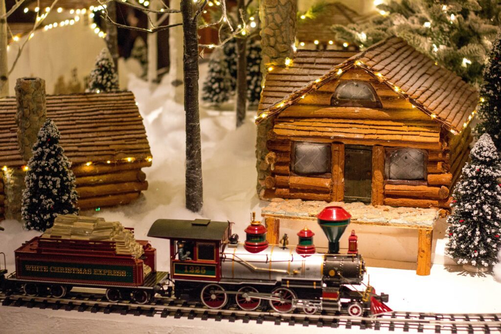 Model train on tracks with Christmas scene