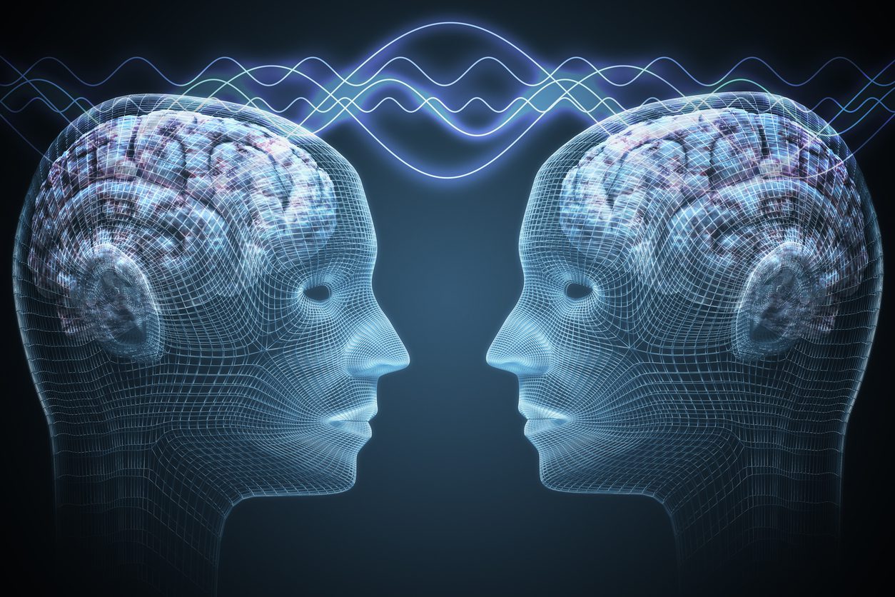 Two wireframe heads face each other with brain visualizations and connecting waves.