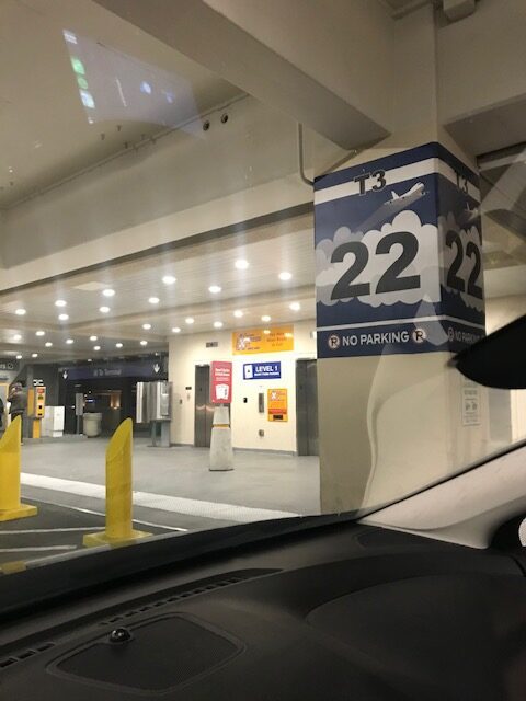 Parking garage sign: T3, space 22, no parking. Airport parking.