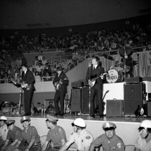 The Beatles perform onstage at the Las Vegas Convention Center during their 1964 North American tour.